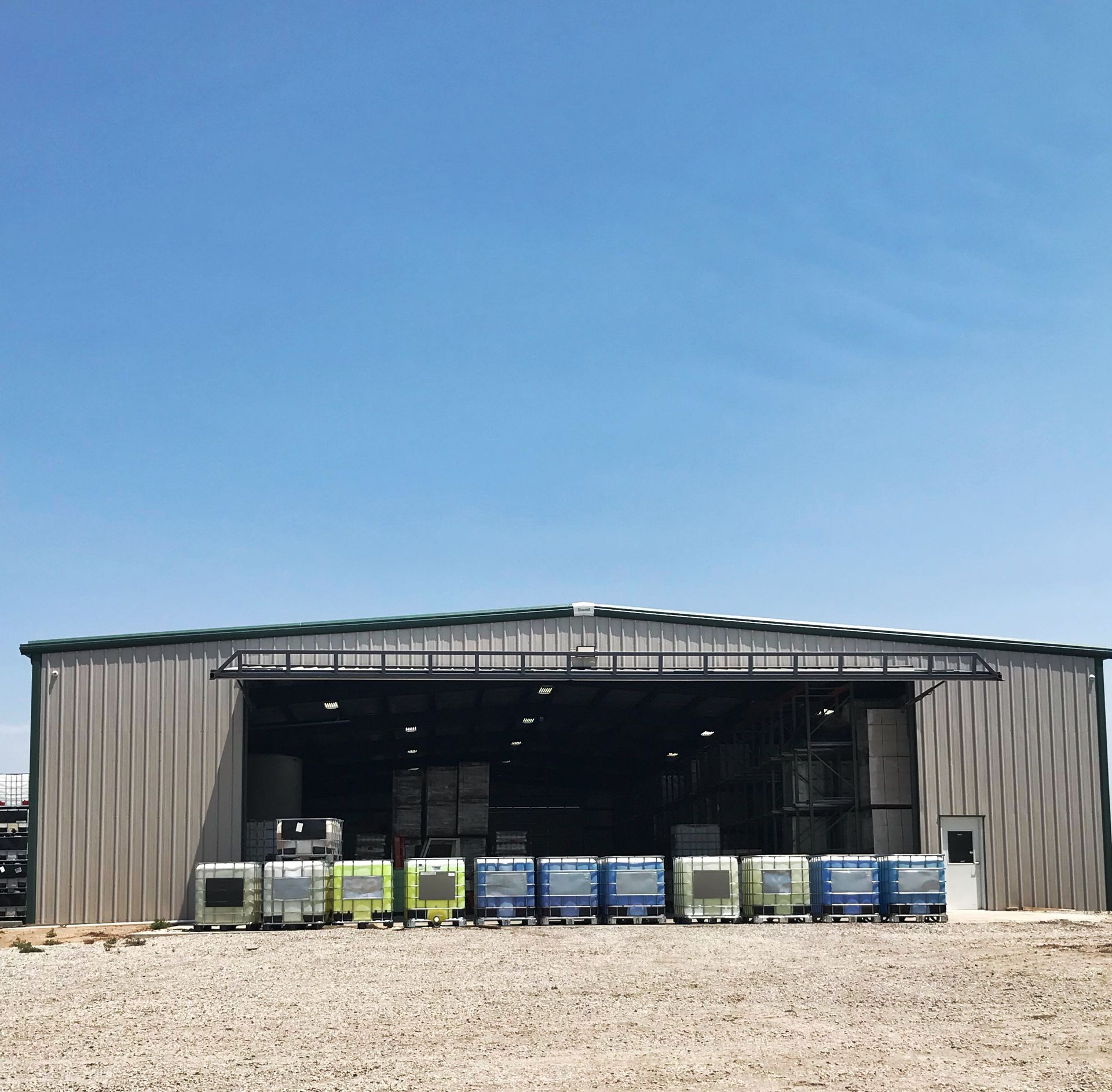 A warehouse with a lot of containers in it