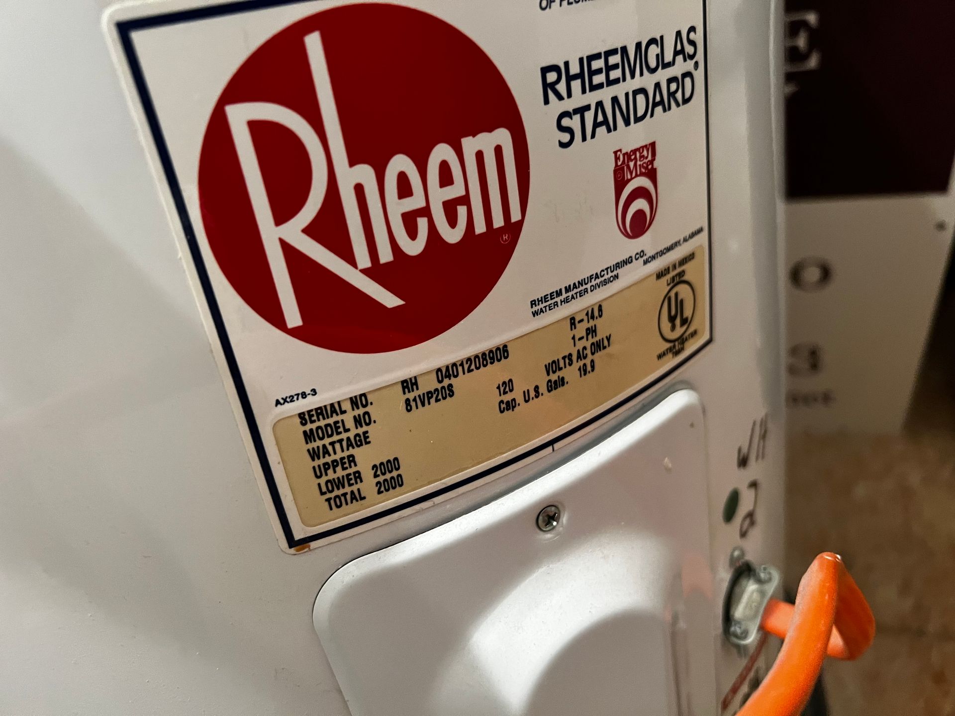 A white water heater with a label that says rheem standard