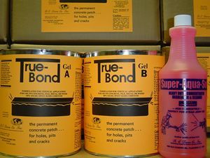 Yellow True-Bond and pink Super-Aqua containers stacked on a shelf