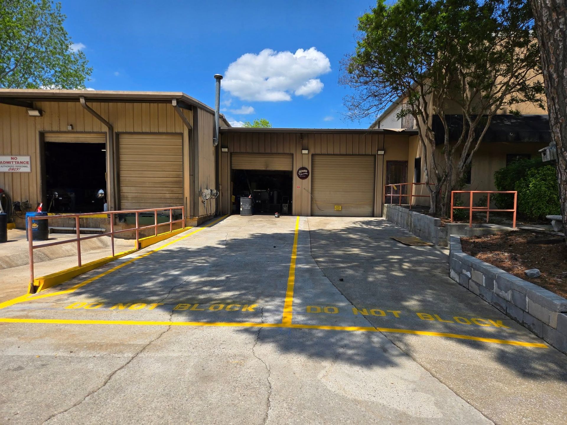 A large building with a parking lot in front of it.