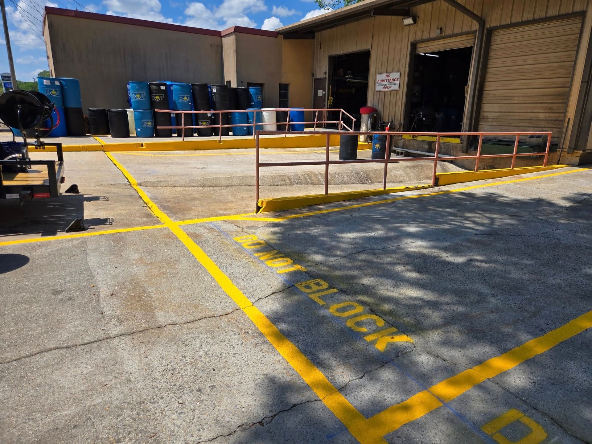 A parking lot with a yellow line that says block on it
