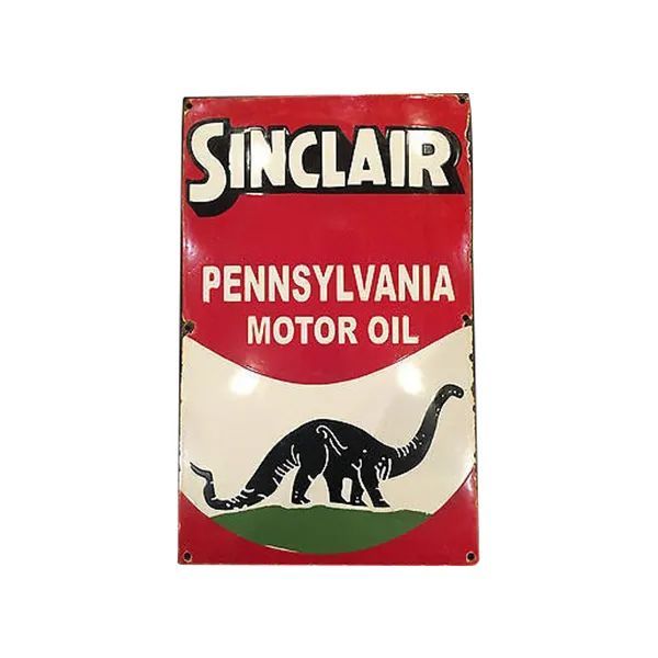 Vintage Sinclair Pennsylvania Motor Oil sign with red background and green dinosaur logo
