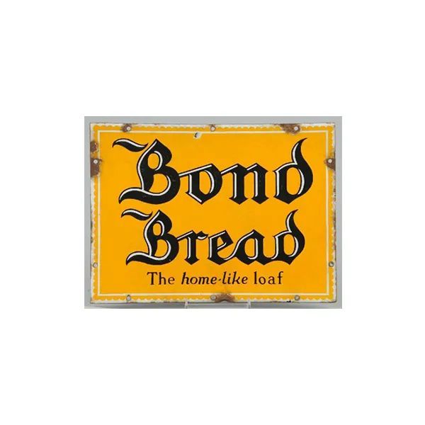 Bond Bread sign on a yellow background reading “The home-like loaf”