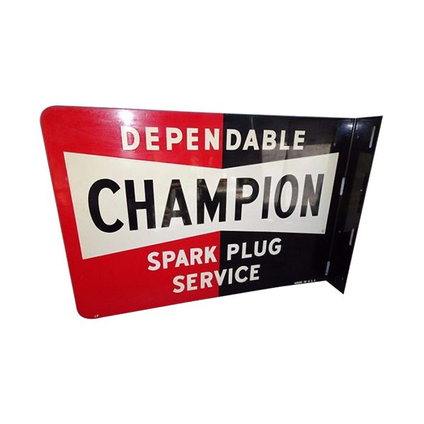 Vintage red and white Champion Spark Plug service sign with black lettering and a right-side bracket