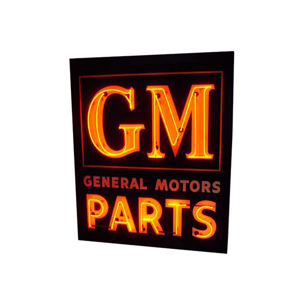 Vintage neon-style GM General Motors Parts sign on a black background, glowing orange and red.