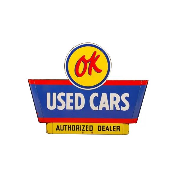 OK Used Cars sign with blue and yellow logo and red banner reading Authorized Dealer