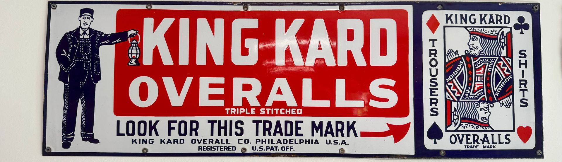 Vintage red-and-white KING KARD OVERALLS ad with a worker illustration and trade mark badge