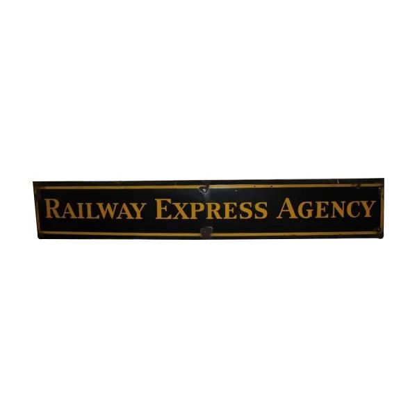 Black-and-gold sign reading “Railway Express Agency” on a white background