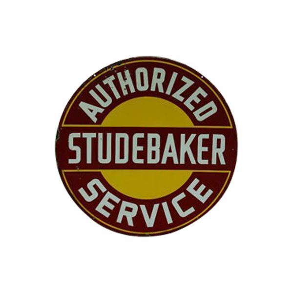 Round Studebaker service badge in red, gold, and black reading “Authorized Studebaker Service”