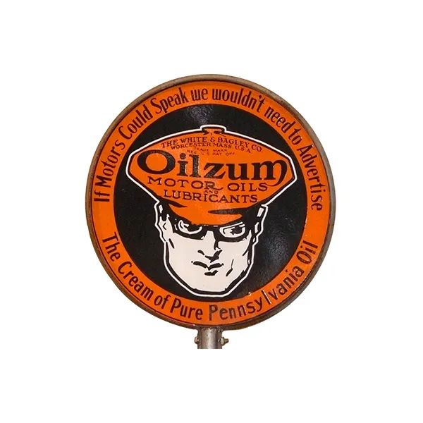 Vintage orange Oildrum Motor Oils sign with a stylized face and circular slogan text
