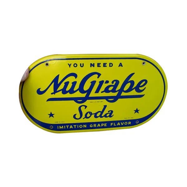 Yellow NuGrape Soda can label with blue lettering and border