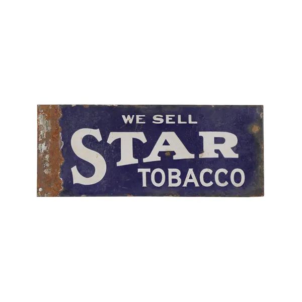 Vintage blue sign reading “WE SELL STAR TOBACCO” in white letters with rusted edges