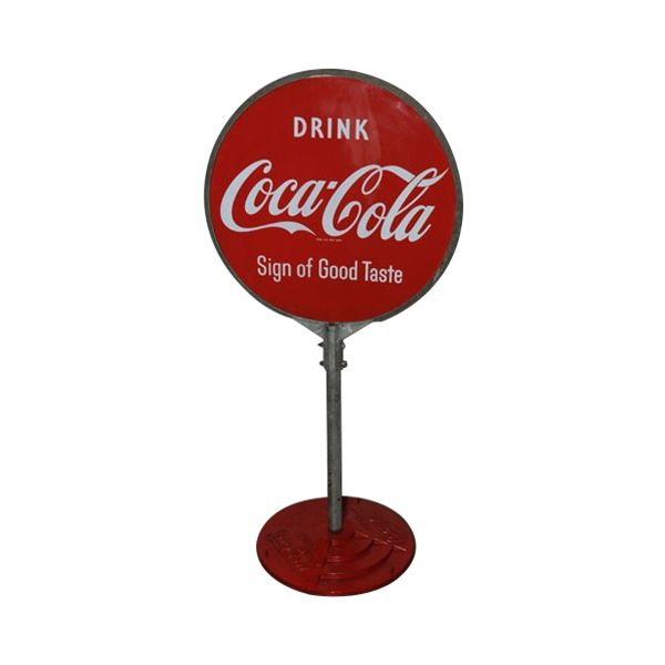 Vintage red Coca-Cola drink sign on a pedestal stand