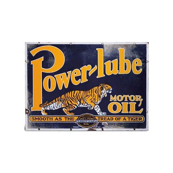 Vintage Power-lube motor oil tin with orange and navy design, featuring a tiger and bold lettering.