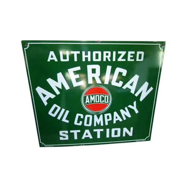 Green AMOCO gas station sign reading “Authorized American Oil Company Station”