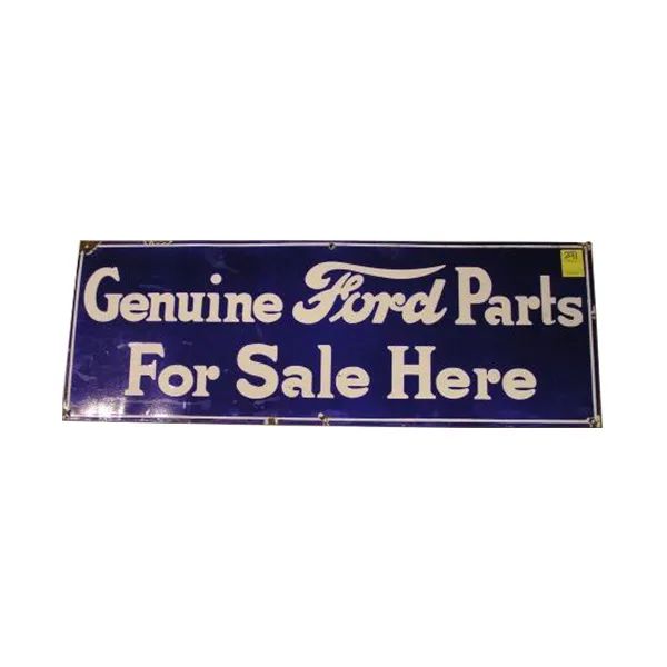 Blue vintage sign reading “Genuine Ford Parts For Sale Here”