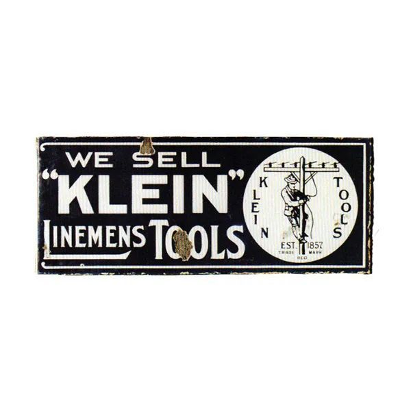 Vintage black-and-white Klein Linemen Tools sign with a clock logo and bold “We Sell” text