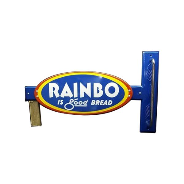 Rainbow bread sign in blue, red, and yellow with the words “RAINBO is good bread”