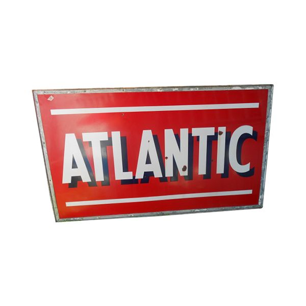 Red Atlantic sign with bold white letters on a rectangular metal plaque