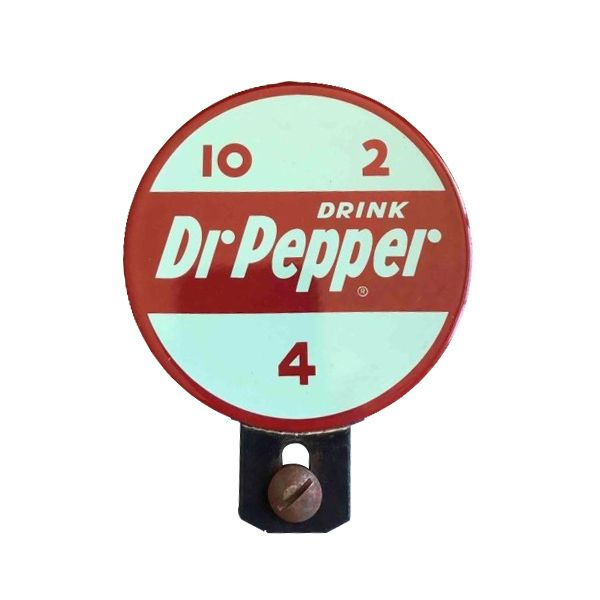 Vintage Dr Pepper round sign with mint green background, red border, and black mounting bracket
