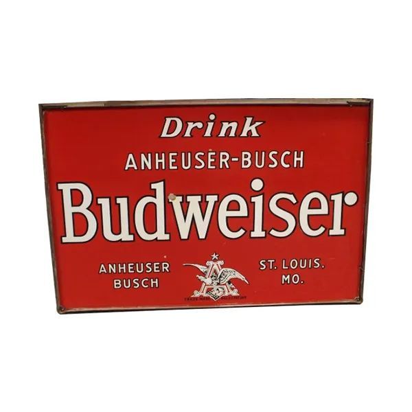 Red Budweiser beer sign with white lettering and Anheuser-Busch branding