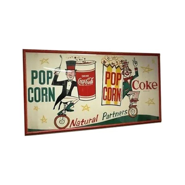 Vintage Coca-Cola popcorn sign with green and red lettering and two popcorn characters on a cream background