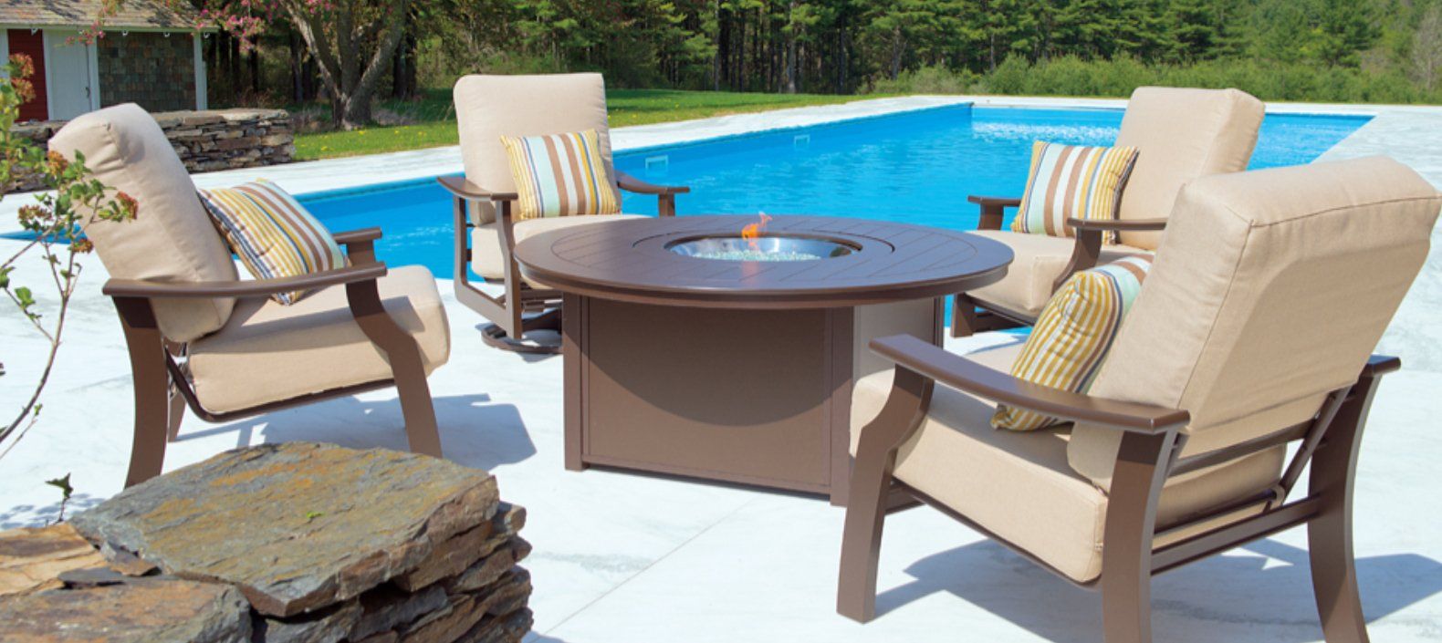 A pool with chairs and table
