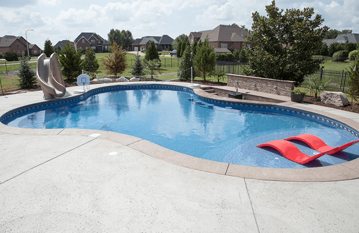 A view of a pool with red chair