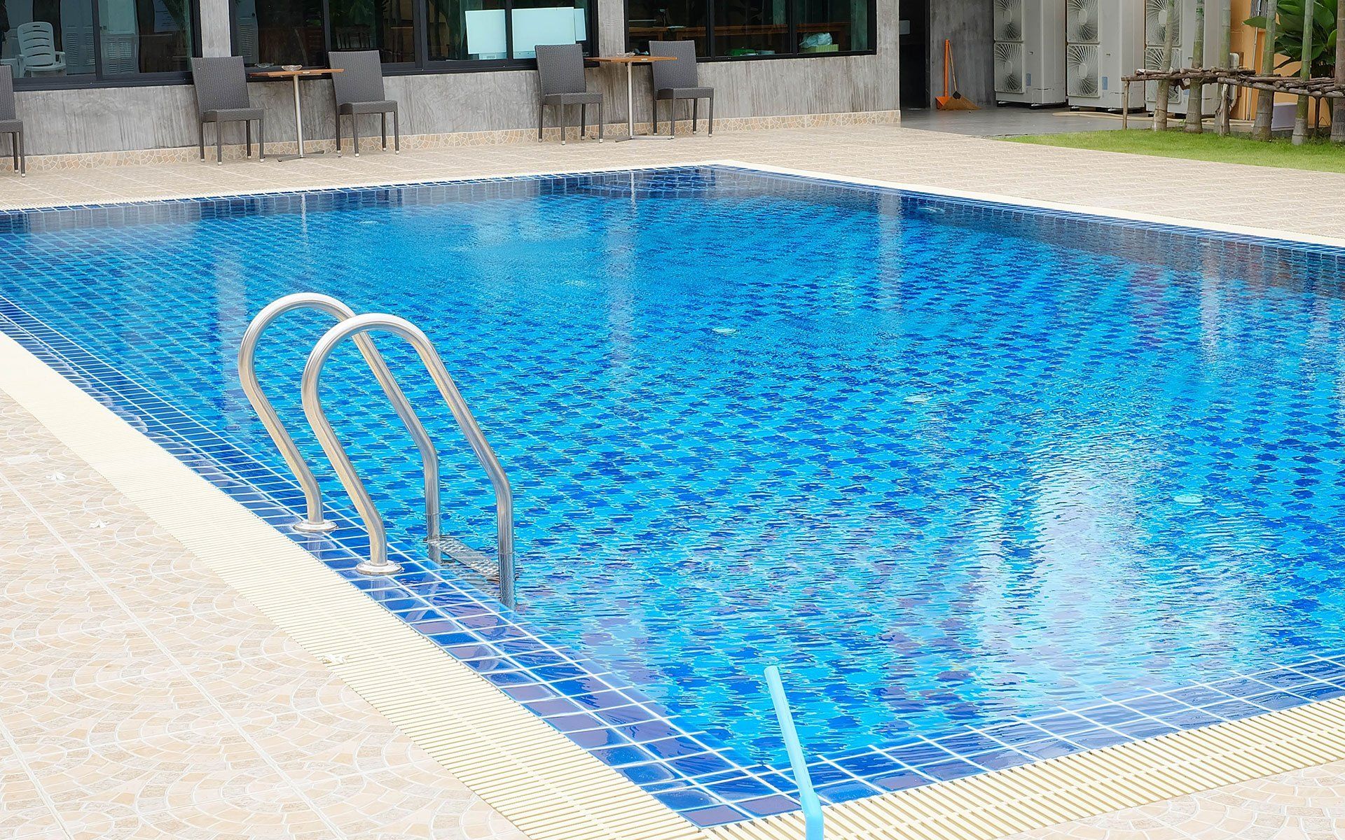 A swimming pool with handle bars