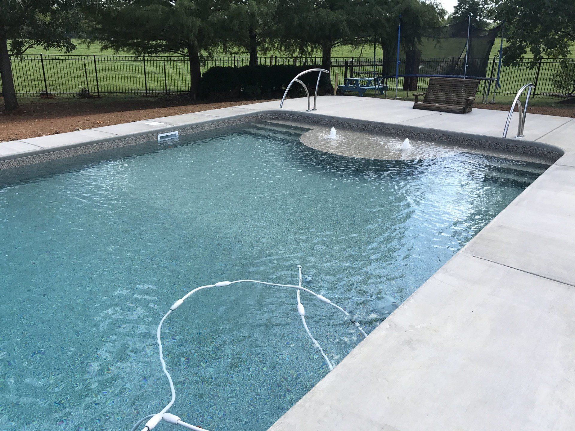 Swimming pool with fountain