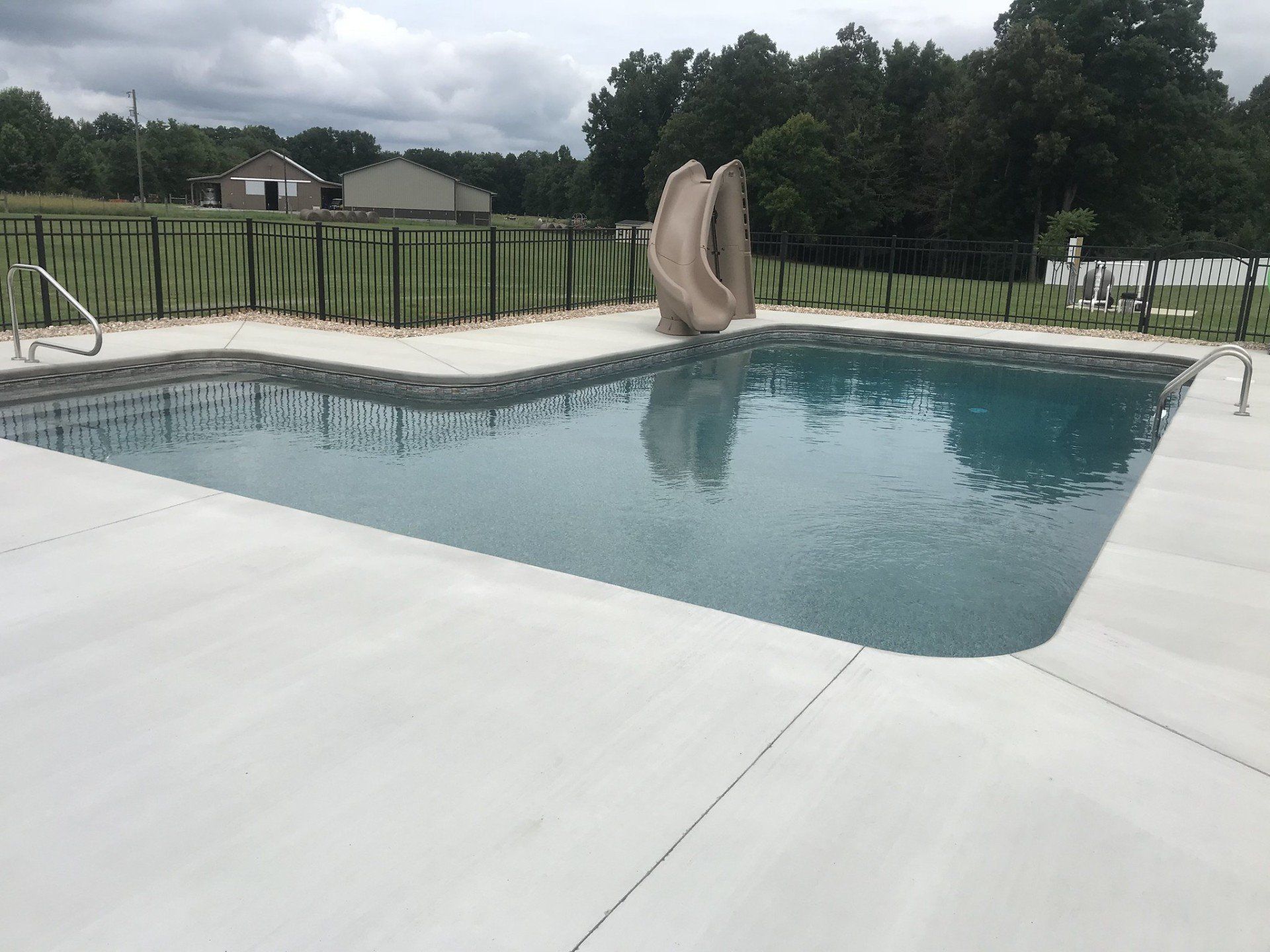 Swimming pool with slide