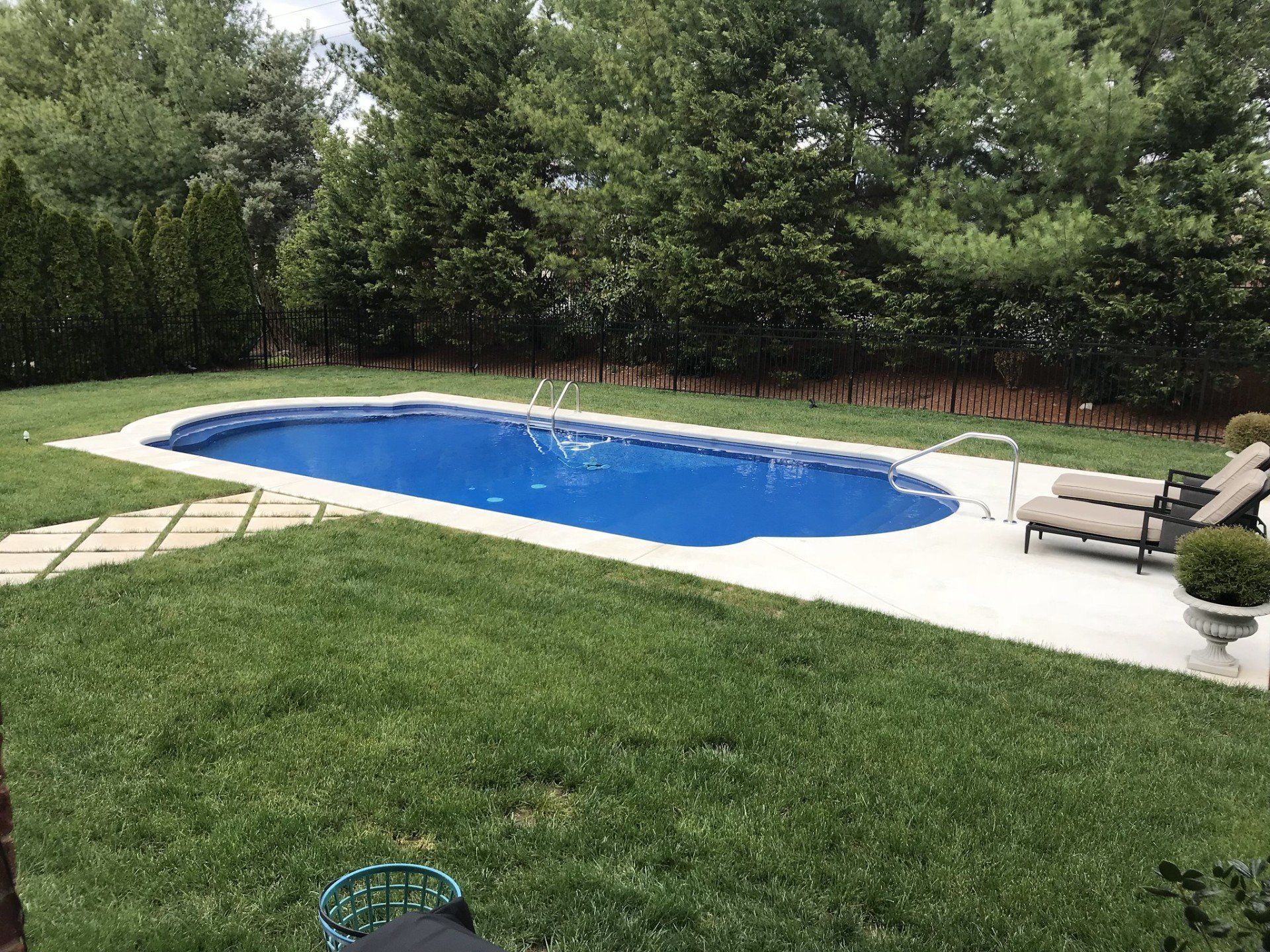 Swimming pool with outside furniture