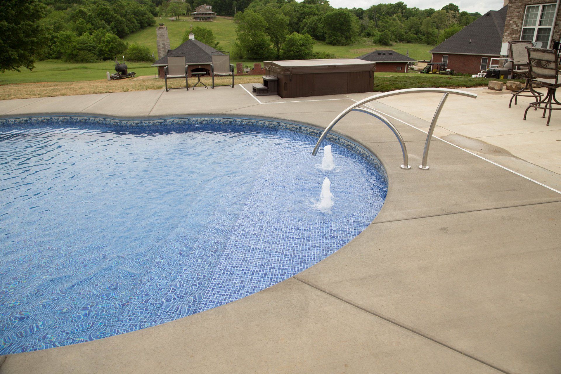 A curved design pool with handle bar