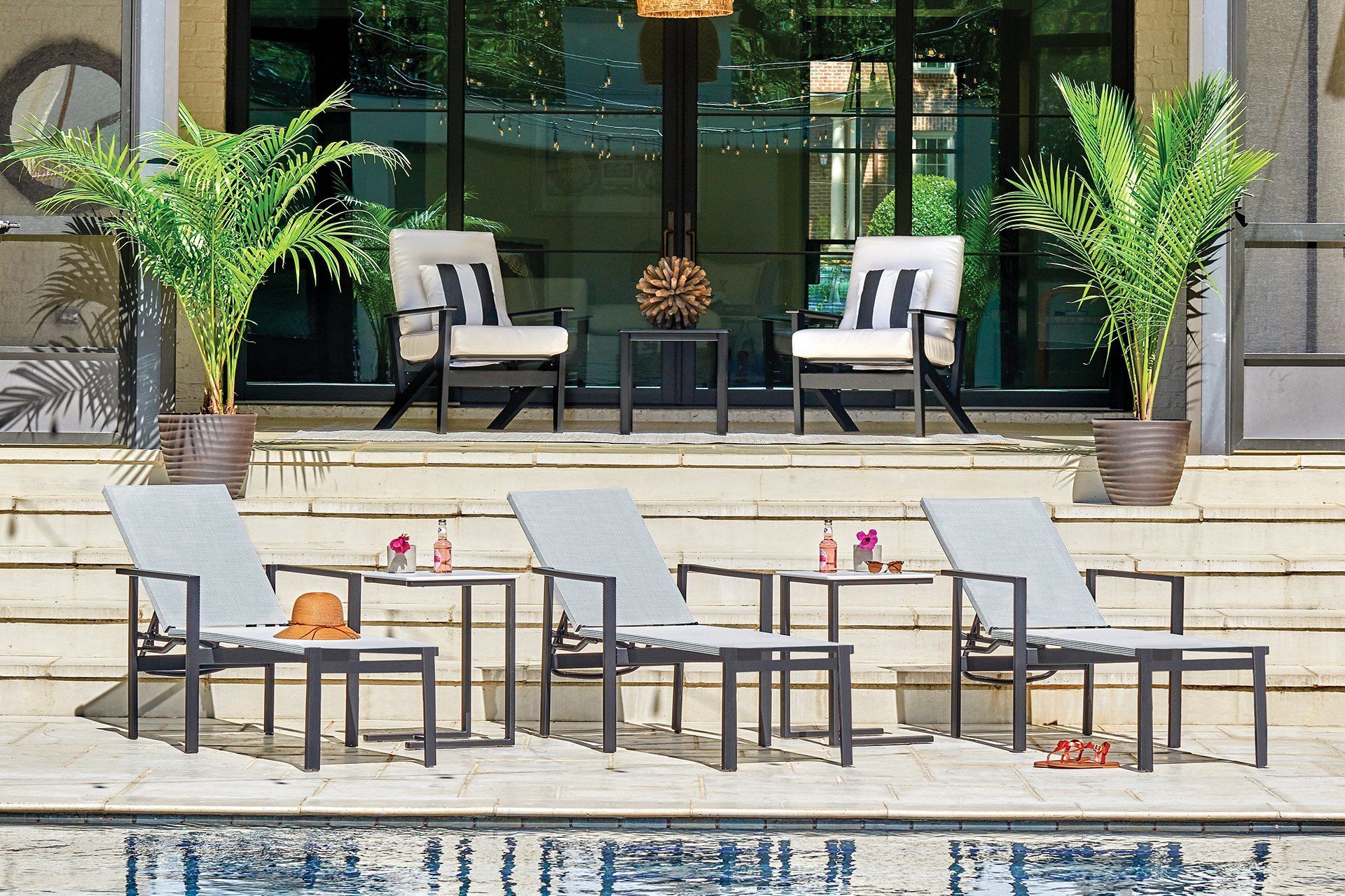 A pool with Outdoor furniture