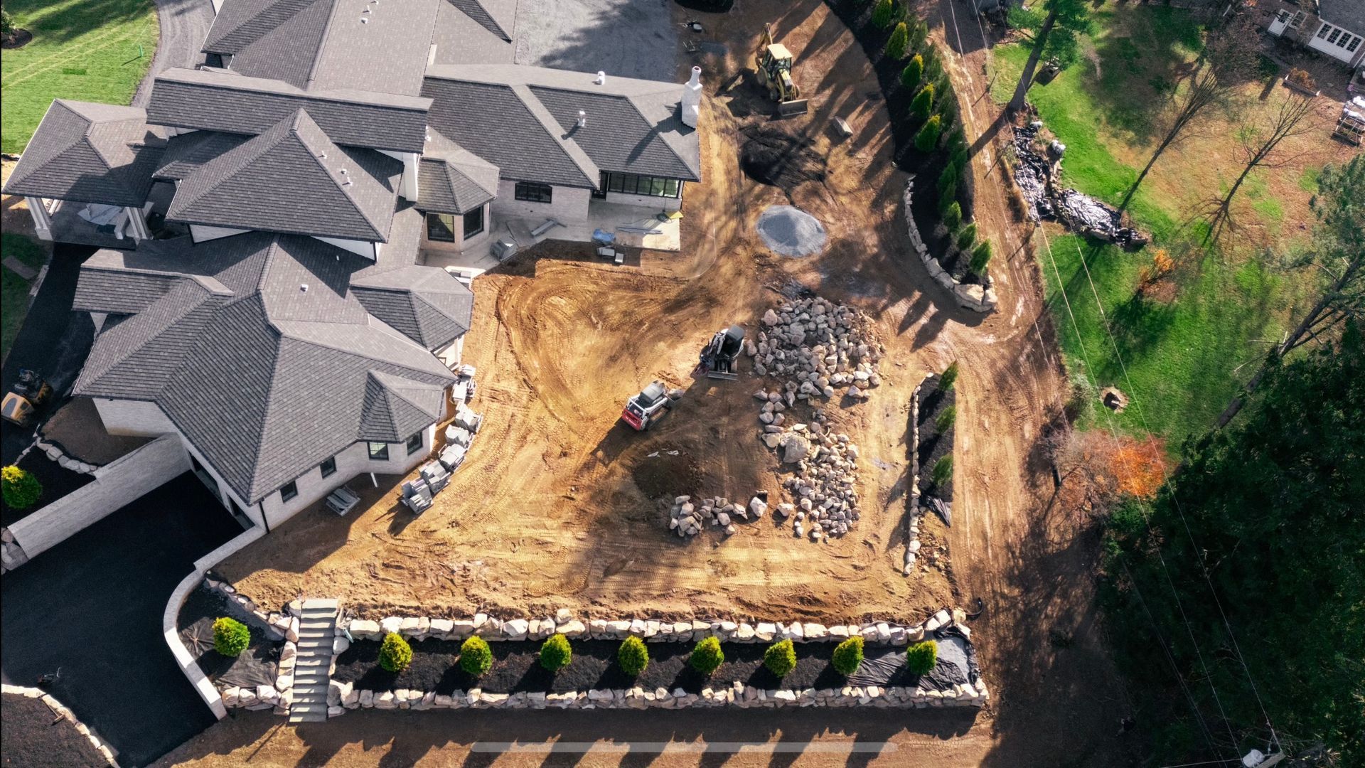 an aerial view of a large house under construction