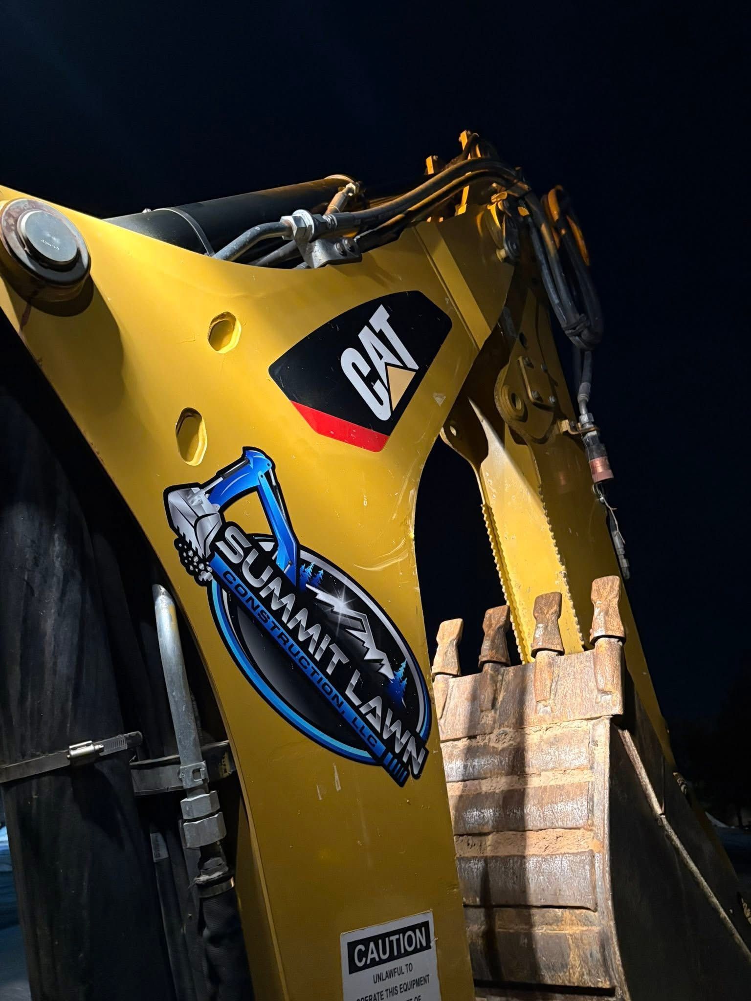 Yellow Caterpillar excavator arm with 