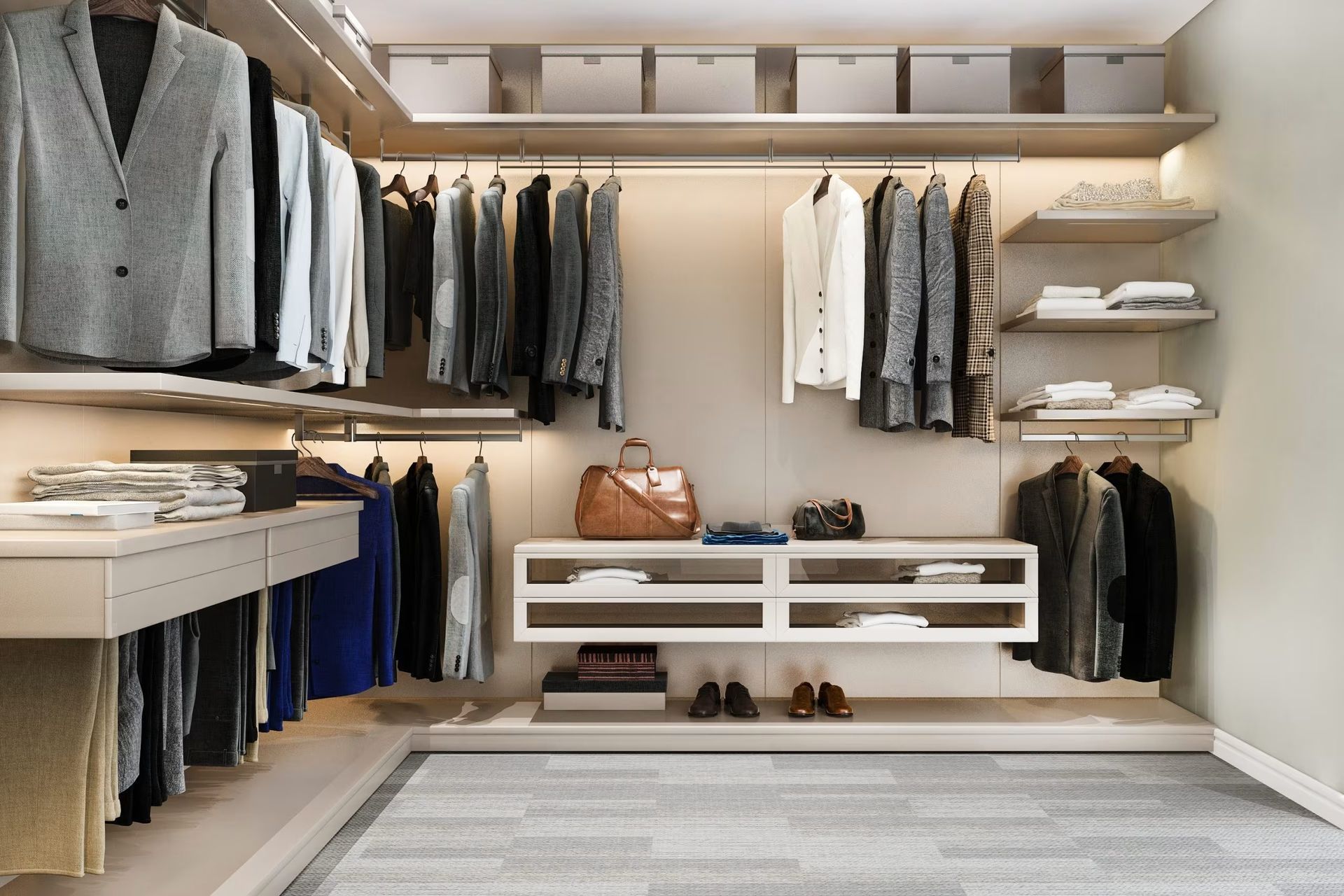 Modern walk-in closet with hanging clothes, shelves, and a bench, in neutral tones