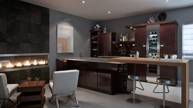 Modern home bar with fireplace, dark wood cabinets, stools, and sleek gray seating in a contemporary room