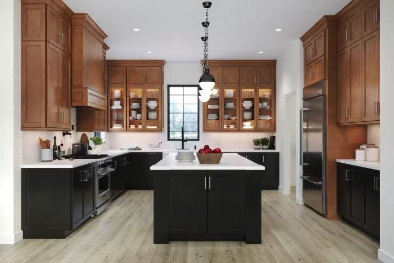 Modern kitchen with black island, wood cabinets, white countertops, and pendant lights