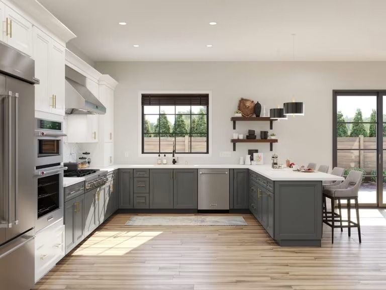 Modern white and gray kitchen with stainless appliances, wood floor, and two windows