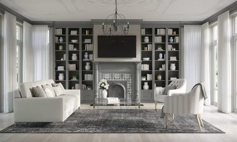 Bright living room with white sofas, black built-in shelves, fireplace, and large windows