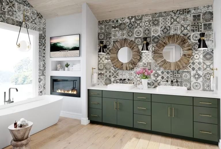 Modern bathroom with freestanding tub, green vanity, patterned wall, and fireplace niche