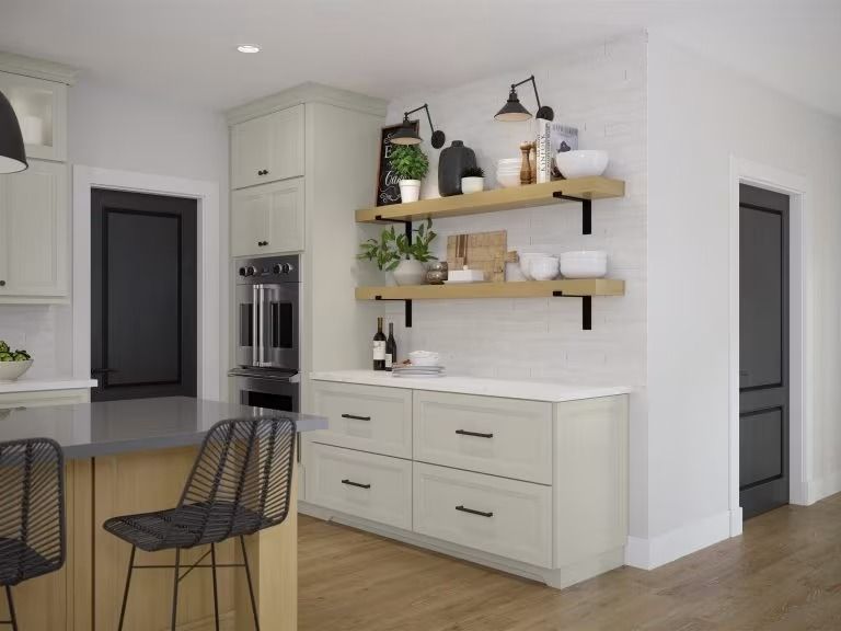 Modern kitchen with light cabinets, open shelves, island stools, and built-in oven