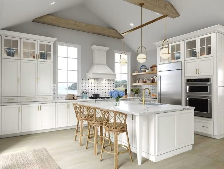 Bright white modern kitchen with island, wooden stools, stainless appliances, and vaulted wood-beam ceiling