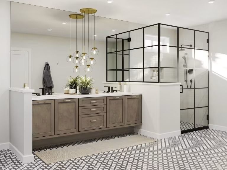 Modern bathroom with double vanity, black-framed glass shower, brass fixtures, and patterned tile floor