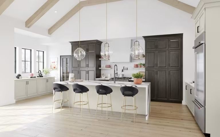 Bright modern kitchen with white island, black stools, dark cabinets, and large windows
