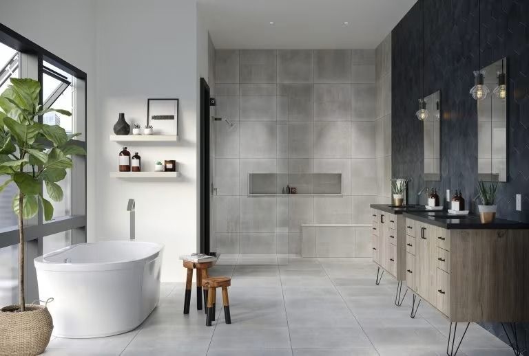 Modern bathroom with freestanding tub, walk-in shower, vanity, and plants by a large window