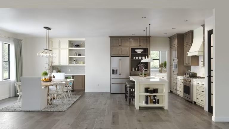 Bright modern open-plan kitchen and dining area with white cabinets, gray floors, and a central island.