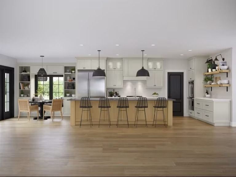 Modern open-plan kitchen and dining room with island, stools, light wood floors, and white cabinetry.