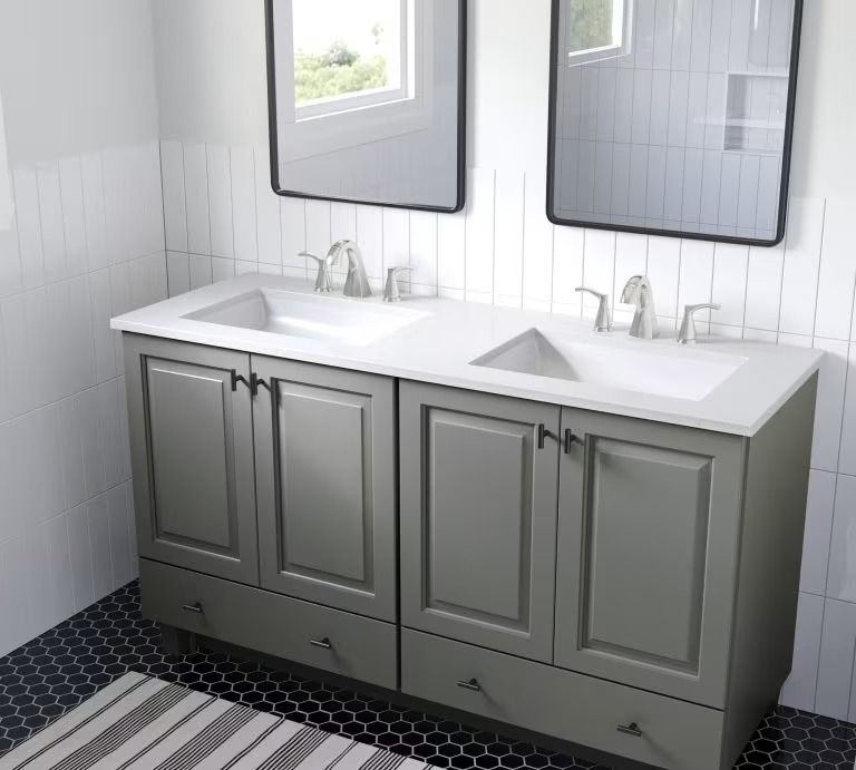 Modern bathroom vanity with double sinks, gray cabinets, and black-and-white tiled floor